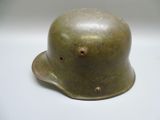 an image of a green helmet on a white surface