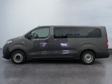 the van is parked in the parking lot on a cloudy day