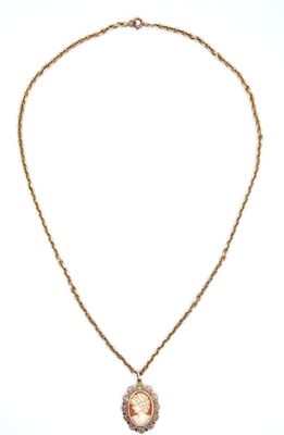 a gold necklace with a picture of a woman on it
