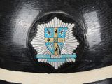 a black hat with a blue crest on it