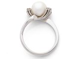 an image of a white pearl and diamond ring on a white surface