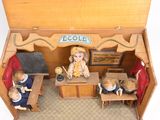 a small wooden box with a doll house inside of it