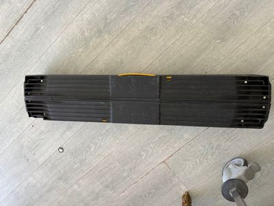 an overhead view of a heater and a hose on the floor