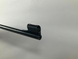 a close up of a gun on a white background