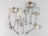 a lot of silver spoons and spoon spoons on the table
