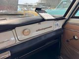 a dashboard of a car with a cell phone on it