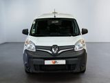 the white van is parked in a large room with a black floor