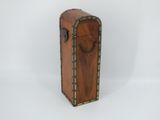 an old wooden suitcase sitting on top of a white surface