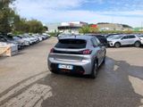 a silver car that is parked in a parking lot