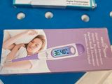 someone is using a digital thermometer to measure their temperature