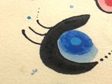 a drawing of a cat ' s face on a piece of paper