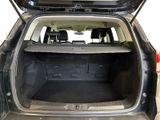 the back of a car with the trunk open and the back of the car in the back