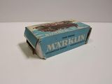 an old matchbox with a train on it sitting on a table