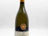 an image of a bottle of wine sitting on top of a table