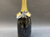 a bottle of champagne with a cork on top of it