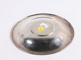 a silver plate with a smiley face on it