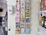 a wall mounted magazine rack in the corner of a store