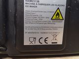 a close up of a radio with a warning sticker on it