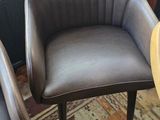 two chairs that are next to each other in a room