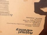 a cardboard box sitting on top of a pile of boxes