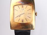 an image of a close up of a wrist watch on a white surface
