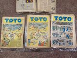 several comics are sitting on the floor next to each other