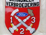 a sticker on the back of a car that has a fire department emblem on it
