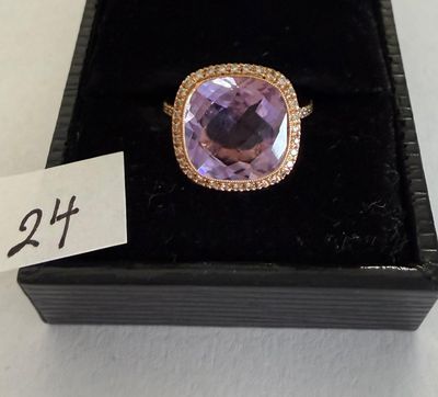 a close up of a ring in a box with a price tag