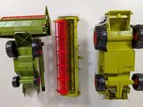 two toy trucks that are sitting next to each other
