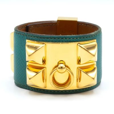 leather cuff bracelet with gold studs and a green leather band