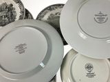 many plates that are stacked on top of each other