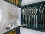 a box with a set of silver spoons and spoons in it