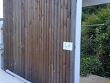 a picture of a wooden building with a sign on it