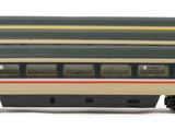 three model trains sitting side by side on a white surface