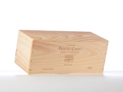 a wooden box with a label on it on a table