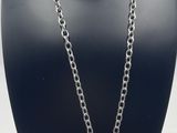 a close up of a necklace on a mannequin with a chain