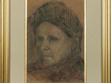 portrait of a woman in a knitted hat by a gold frame