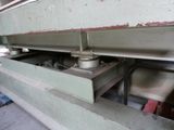 an image of a machine that is working on a piece of metal