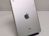 an apple ipad sitting on top of a table next to a white wall