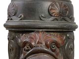 a close up of a fire hydrant with a face on it