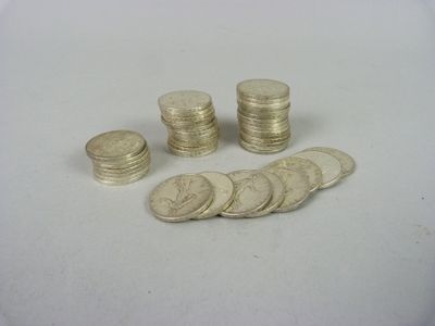 a pile of coins sitting on a table next to a pile of coins