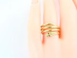 a woman ' s hand with a ring on it ' s finger