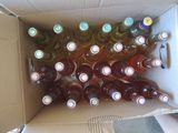 many bottles of wine in a box on the floor