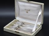 a box with a set of forks and spoons in it