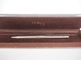 an image of a pen sitting inside of a box on top of a table