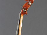 a close up of a violin on a gray background