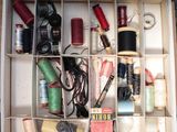 a box filled with many different types of sewing supplies