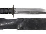 a knife that is laying on top of a leather sheath