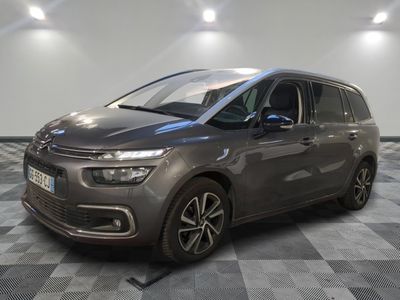 a grey citrole is parked on a checkered floor