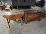 two tables that are sitting in the middle of a room